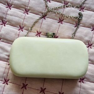 Beige clutch/crossbody bag.